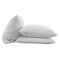Three AllergyCare Cotton white pillow protectors on a white background