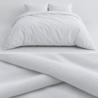 AllergyCare cotton duvet cover on a bed, with a close-up of the folded cotton fabric