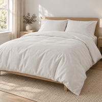 Natural cream AllergyCare organic cotton duvet cover on a bed in a bright bedroom