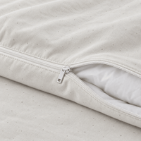 Close-up of the zipper on the AllergyCare organic cotton duvet cover, partly open over a comforter