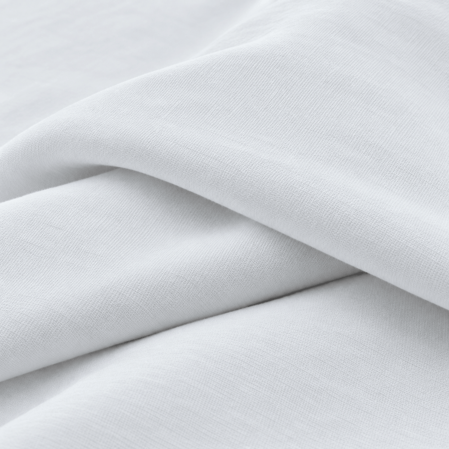 Close-up of the smooth white stretch knit fabric
