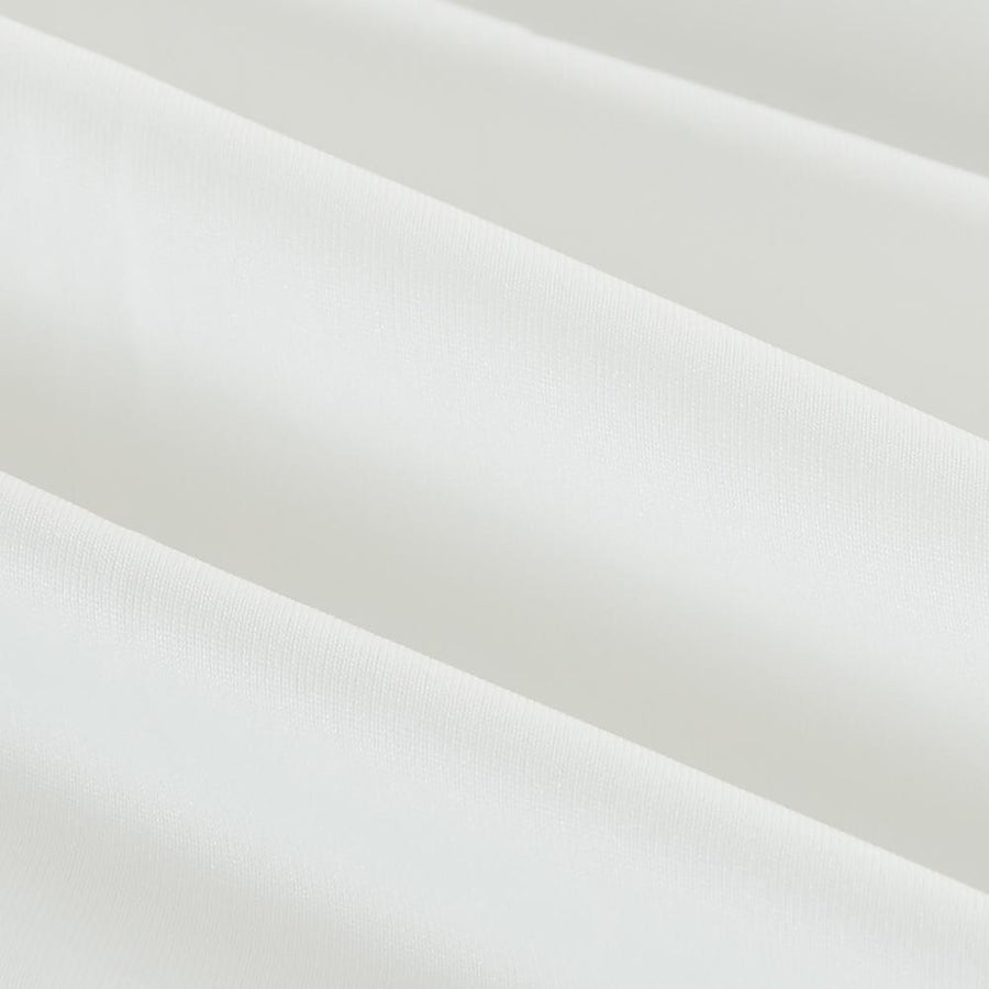 Smooth white polyester knit surface of the AllergyCare stretch knit duvet cover