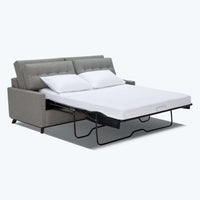 Bargoose Quilted Waterproof Sofa Sleeper Mattress Pads - Anchor Band on a pull-out couch with pillows.